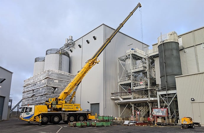 Crane and powered access lift for biomass energy plant
