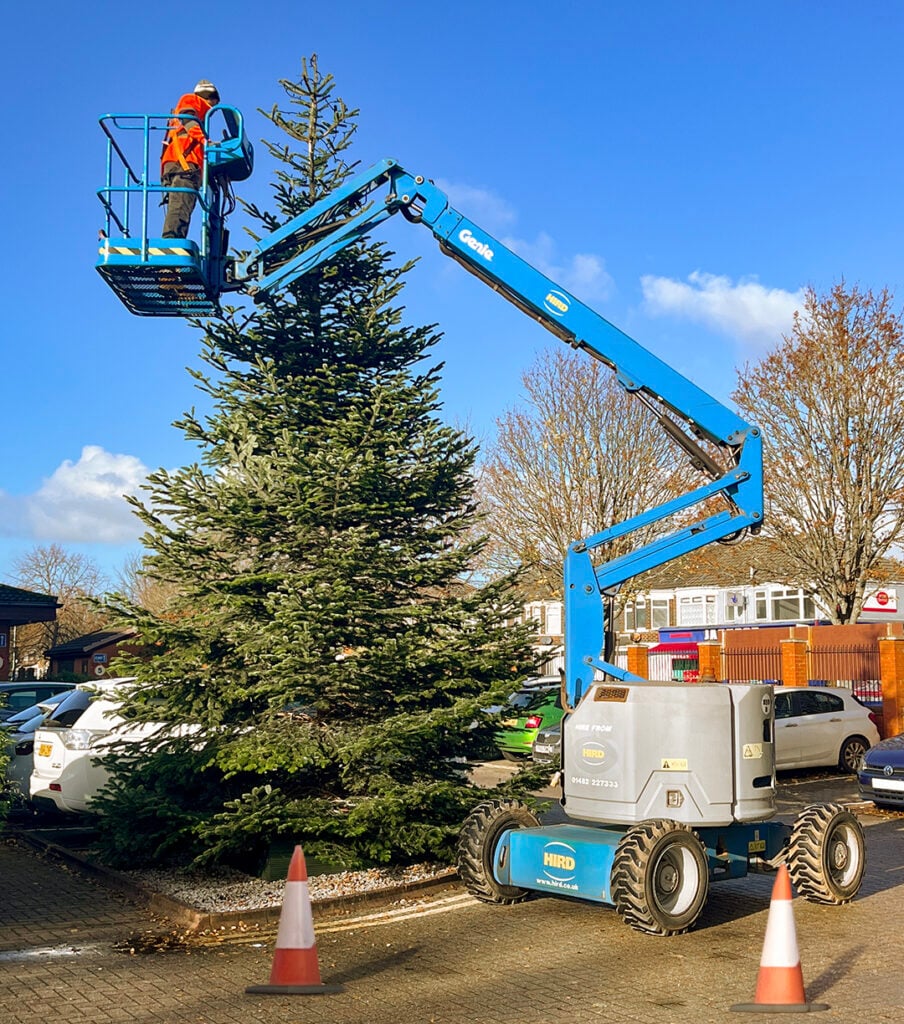 
Hird-Supporting-Dove-House-Hospice-Care-Christmas-Tree-Install-Genie-Z34-22-Boom-Lift-cones