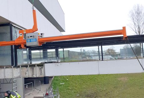 Counterbalance lifting beam supports council glass installation