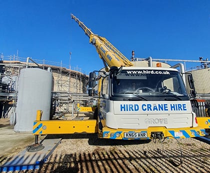Mobile crane team backs digester membrane installation