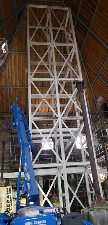erecting a five-story lift shaft frame inside a former kiln using maeda mini crane and bi energy cherry picker